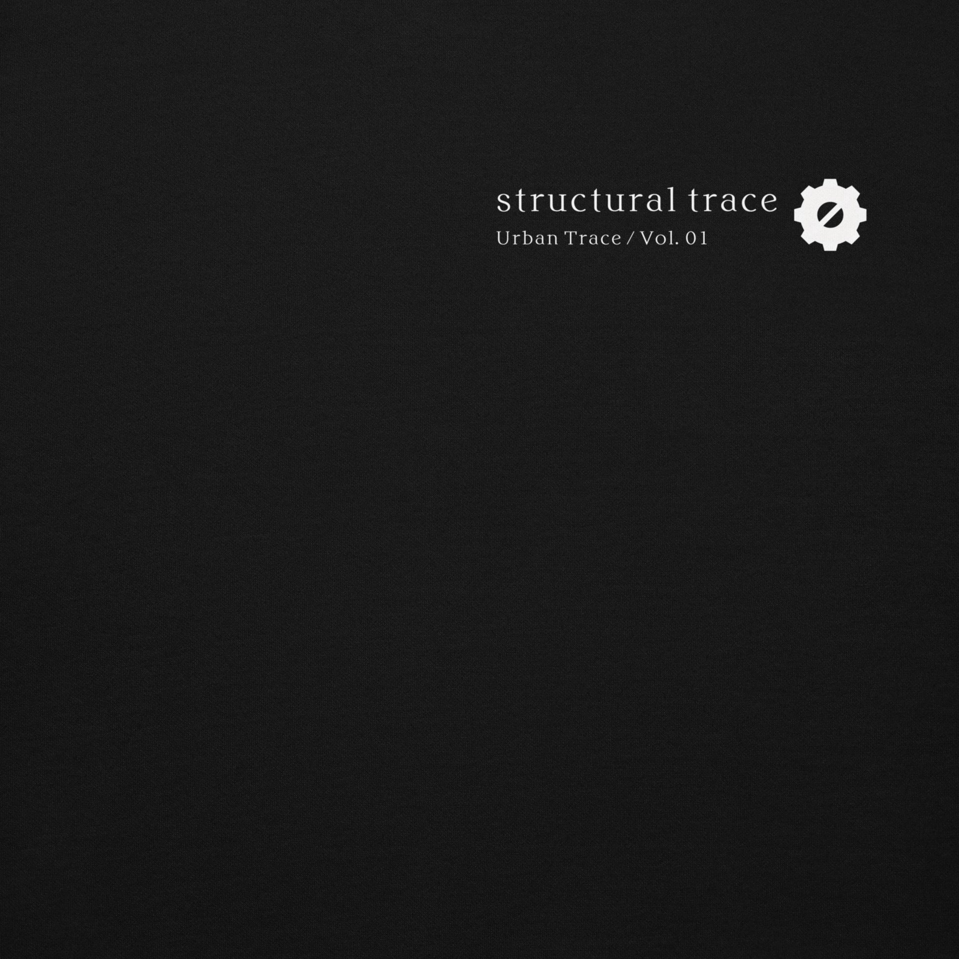 Minimalist gear symbol logo detail on black hoodie, Japanese industrial streetwear aesthetic.