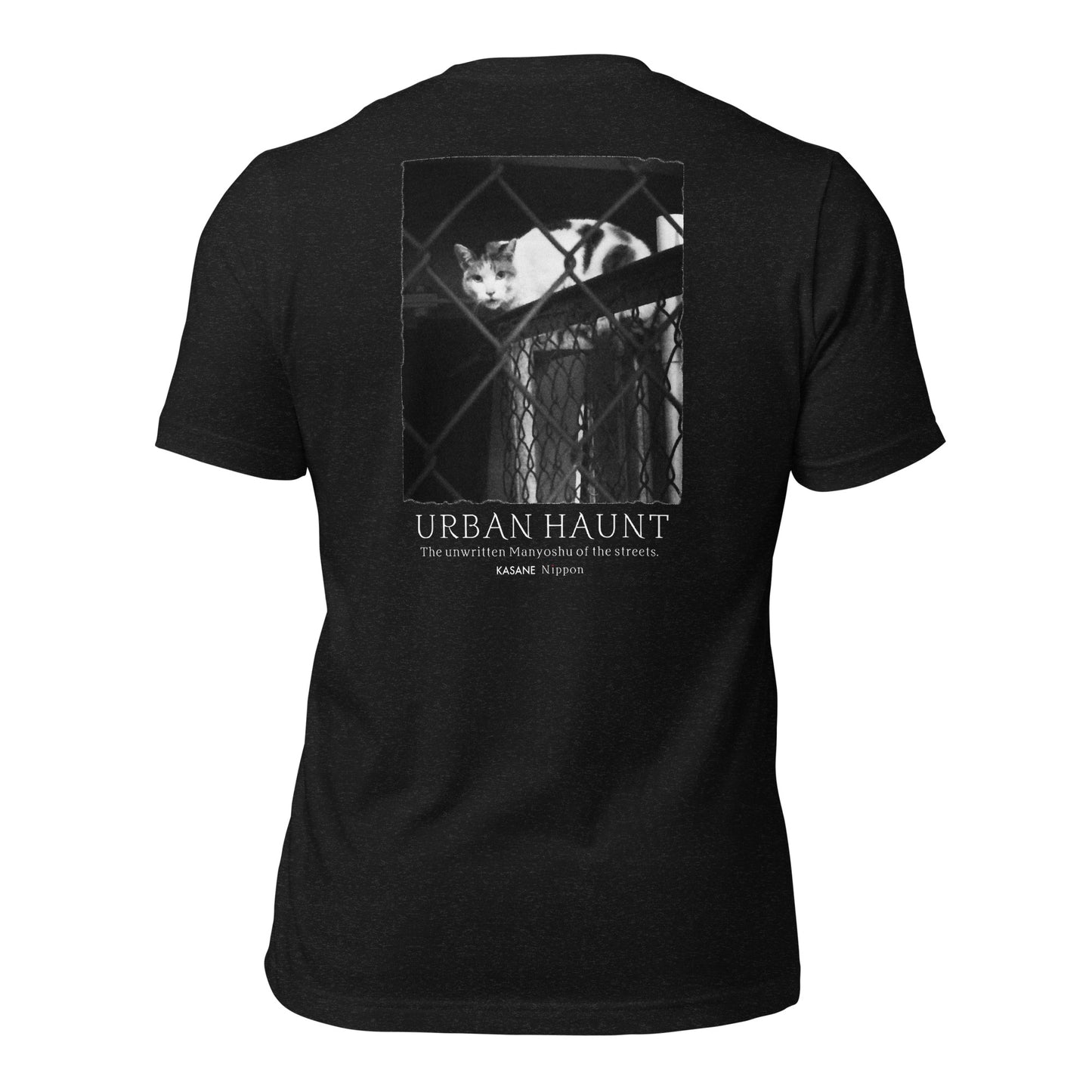 Back view of black minimalist Japanese graphic t-shirt featuring monochrome street cat behind chain-link fence photography.